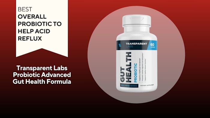 White pill bottle with blue writing that says "GUT HEALTH" against a red background